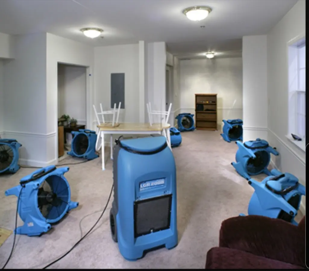 Air movers and dehumidifier setup for Water Damage Restoration in Raton